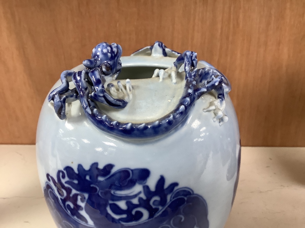 A Chinese blue ground blue and white dragon design vase, 17cm high